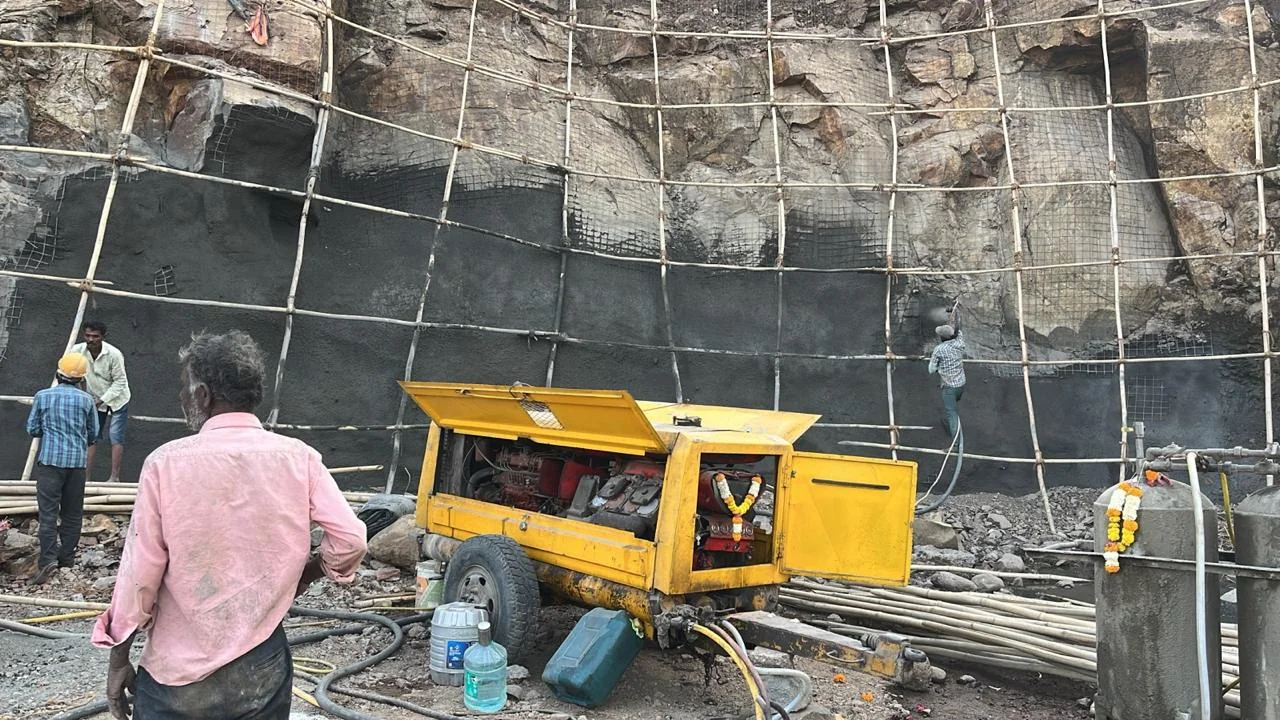 Workers Applying Guniting on Site - Bhoomi Constructions Team in Action